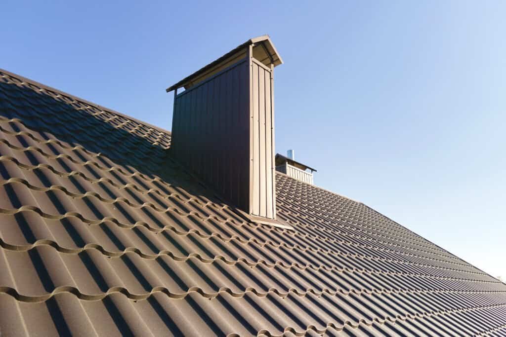 Metal roof with chimney and vent, residential roofing, metal roofing contractor.