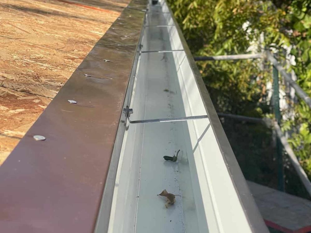 Durable metal flashing installed on roof edge for weatherproofing and protection.